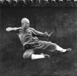 kicking monk in mid air